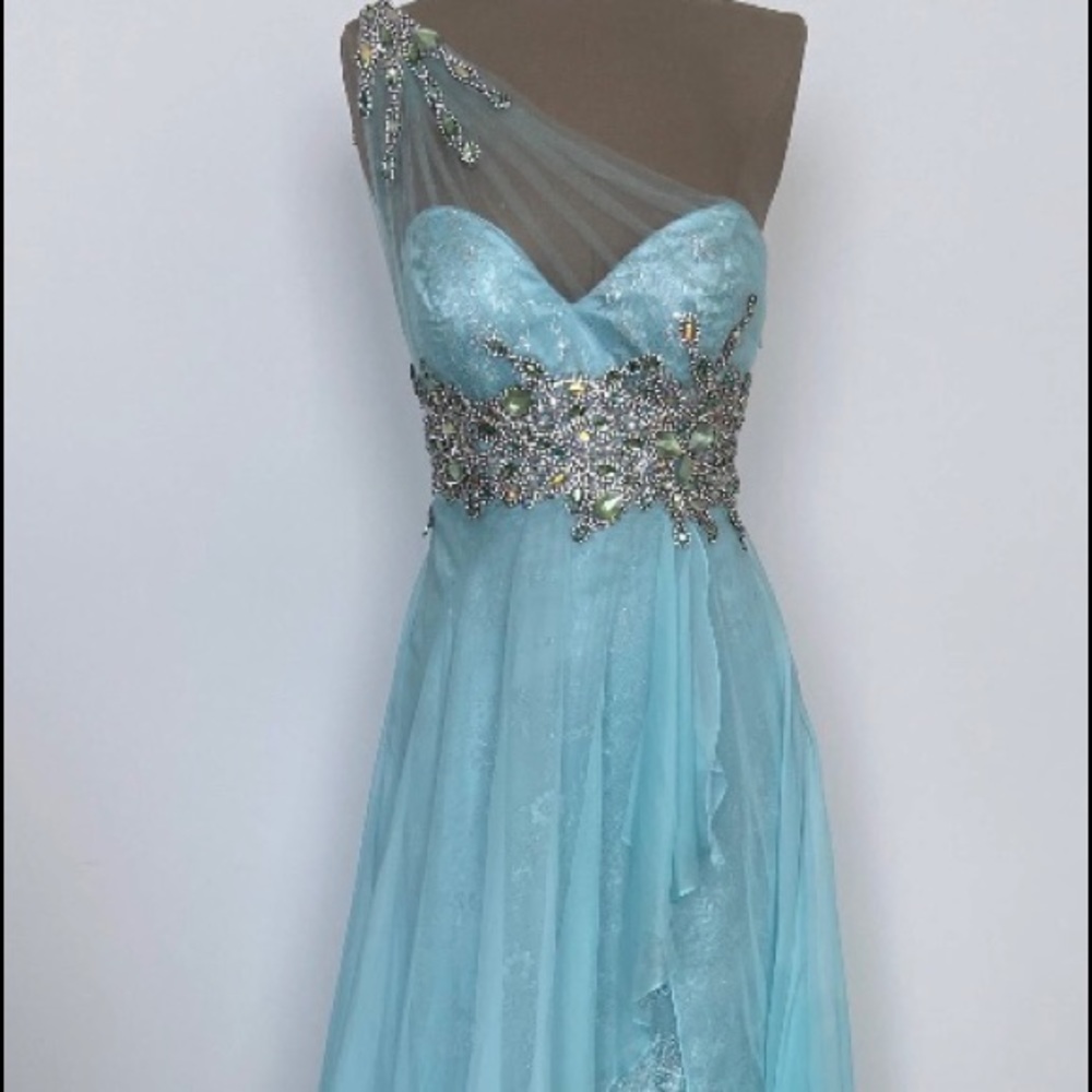 Blue A line evening gown with cape and jewels
